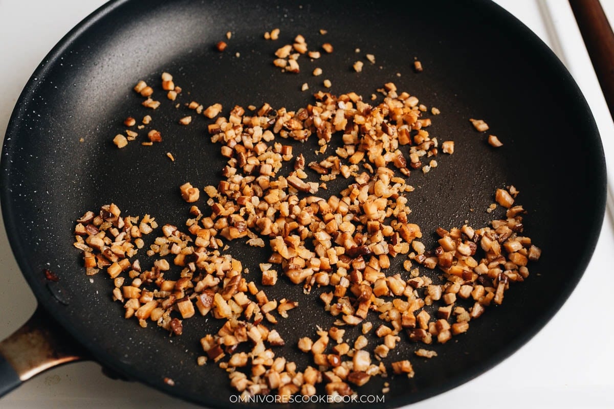  mushrooms and shrimp cooking in a pan