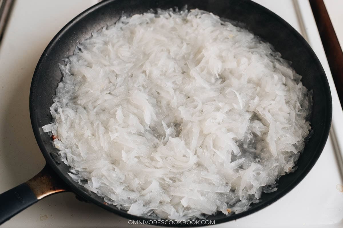 daikon radish and water in the skillet