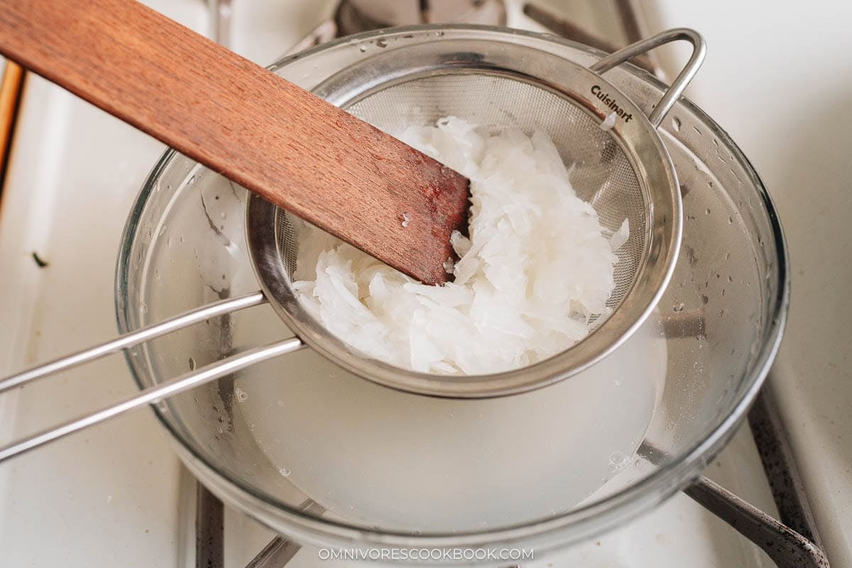 Strain the cooked daikon over a colander