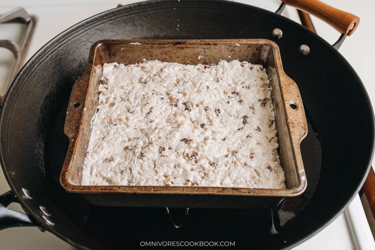Greased baking dish filled with mixture.