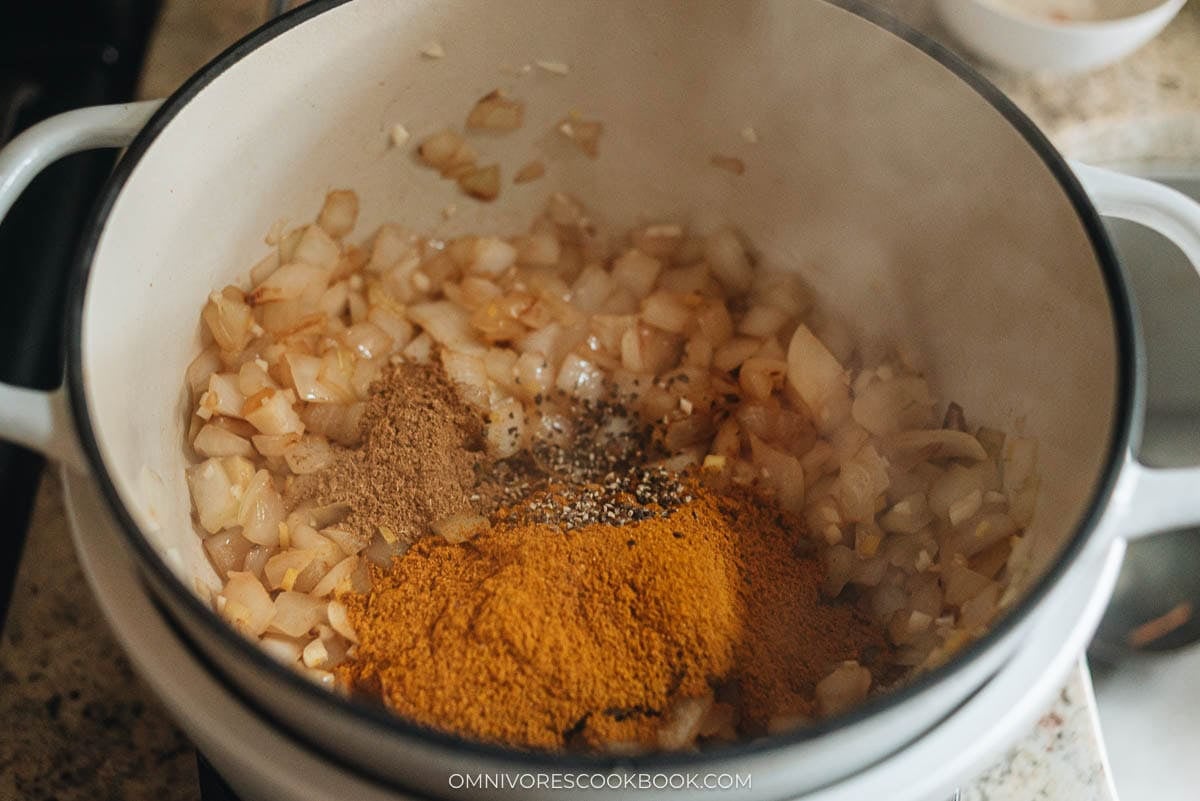 Cooking the aromatics and spices in a pot