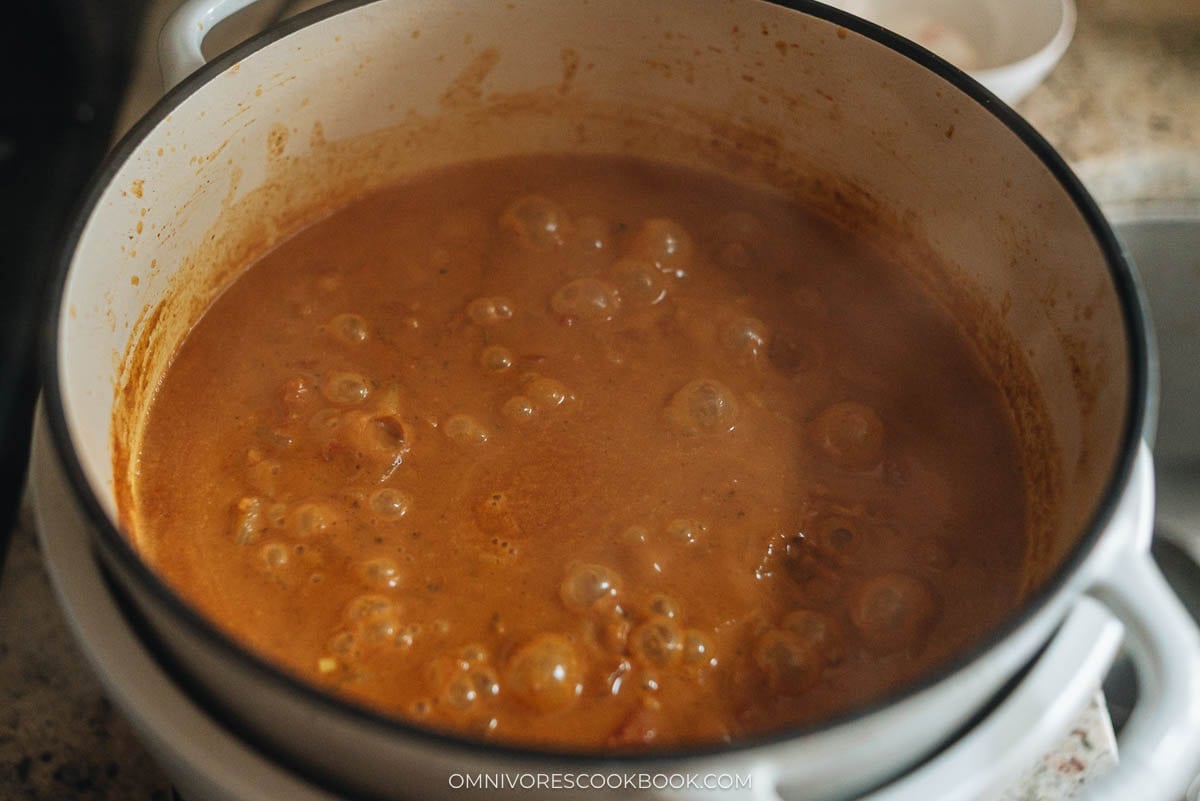 simmering the curry in a pot