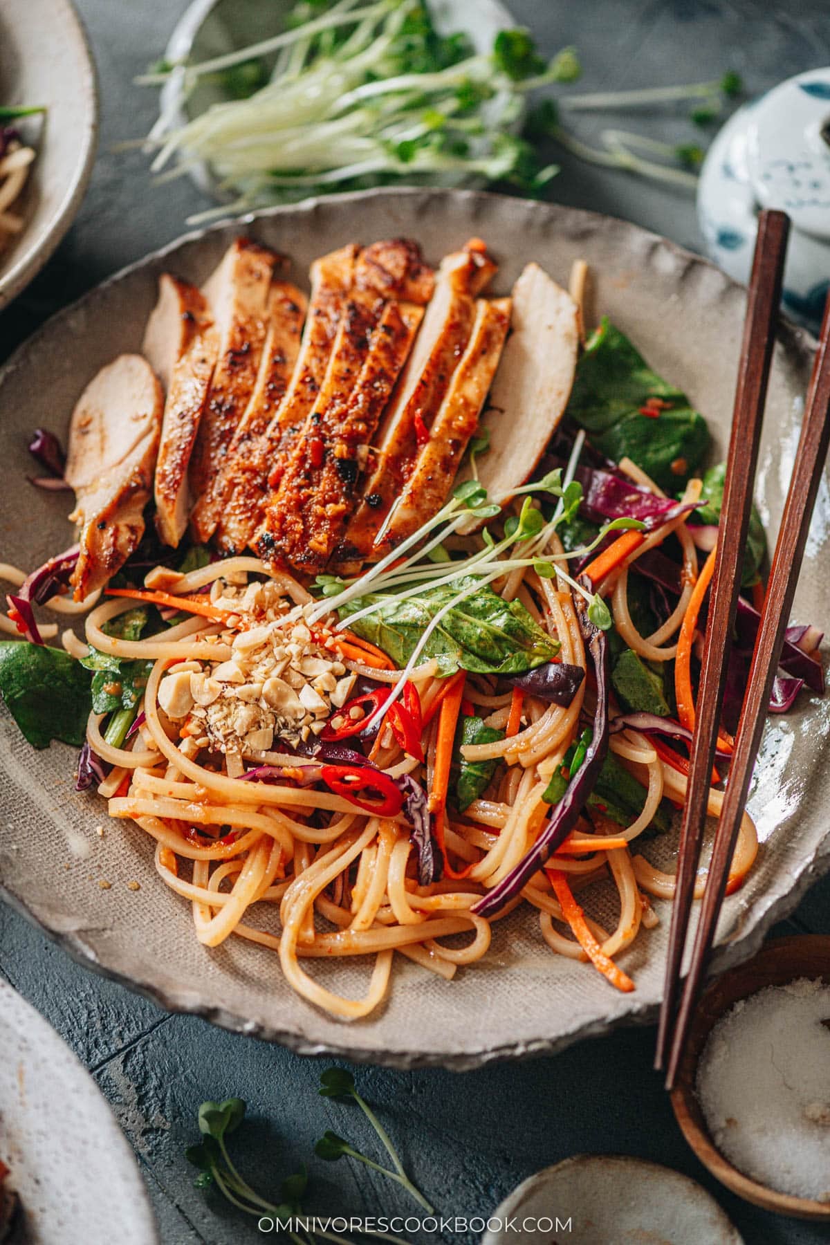 Spicy rice noodle salad topped with chicken
