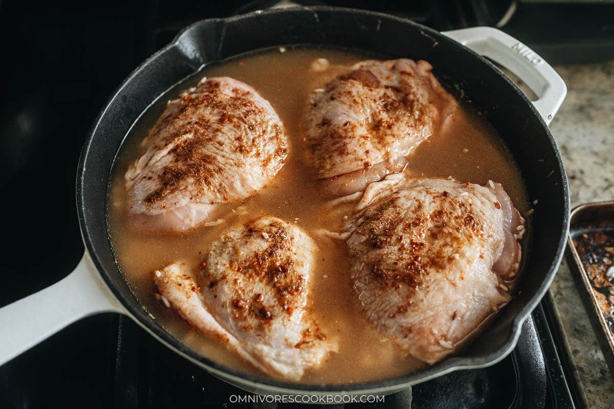 broth, seasoning, and chicken in a skillet