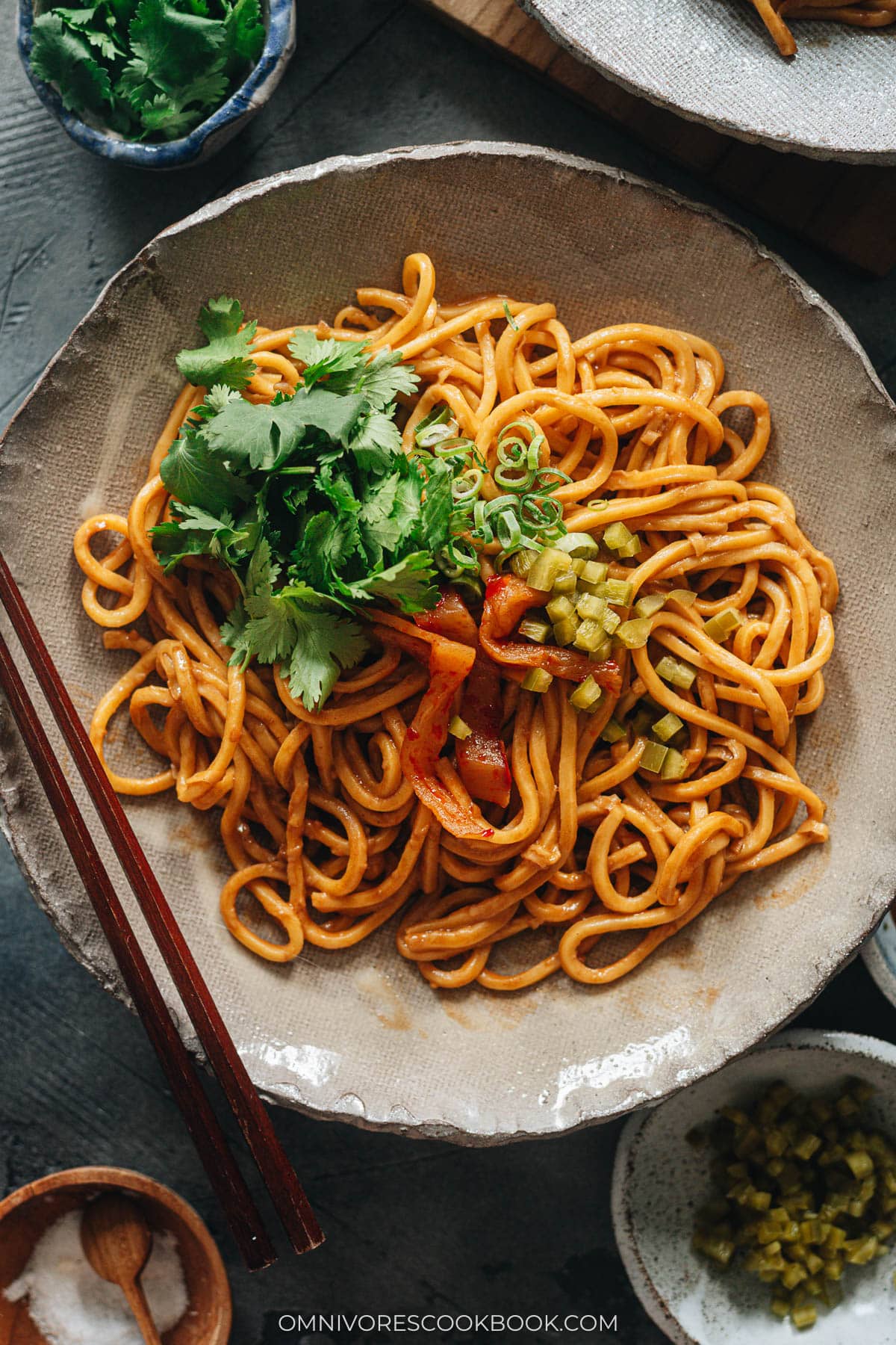 Hot Dry Noodles serve on a plate with greens