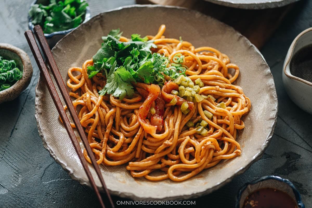 Hot Dry Noodles serve on a place with toppings
