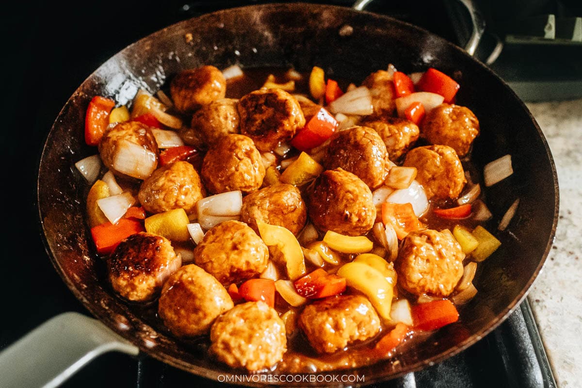 combine meatballs, sauce and vegetables in a skillet