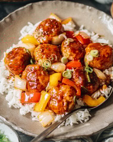 Meatballs with sweet and sour glaze over rice