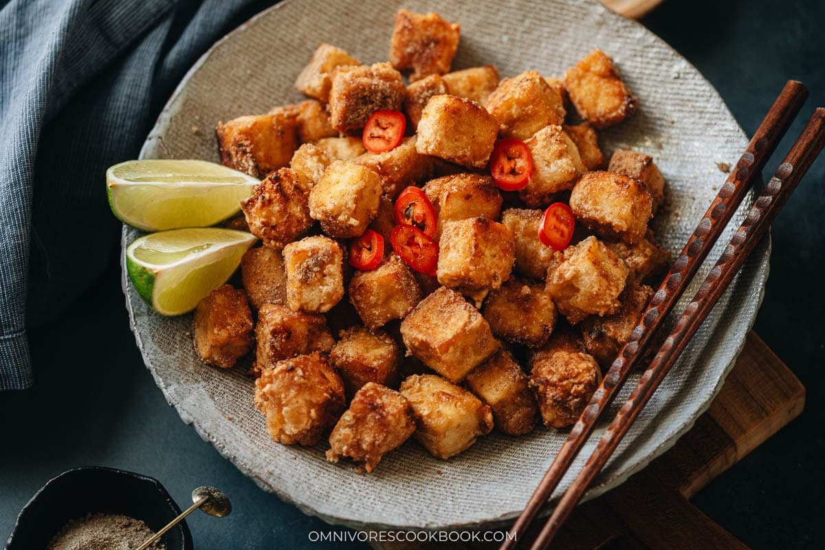 Salt and Pepper Tofu serve on a plate with lime