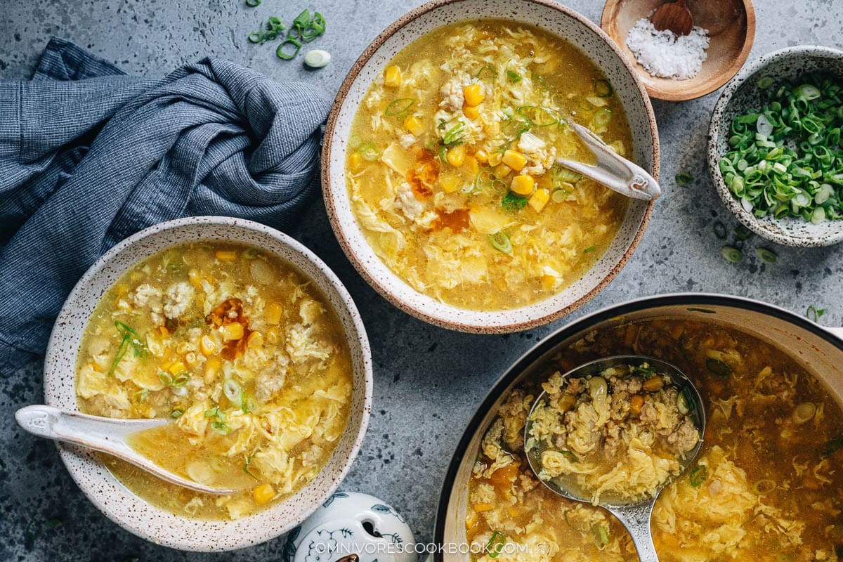 Chinese corn soup with chicken served in bowls