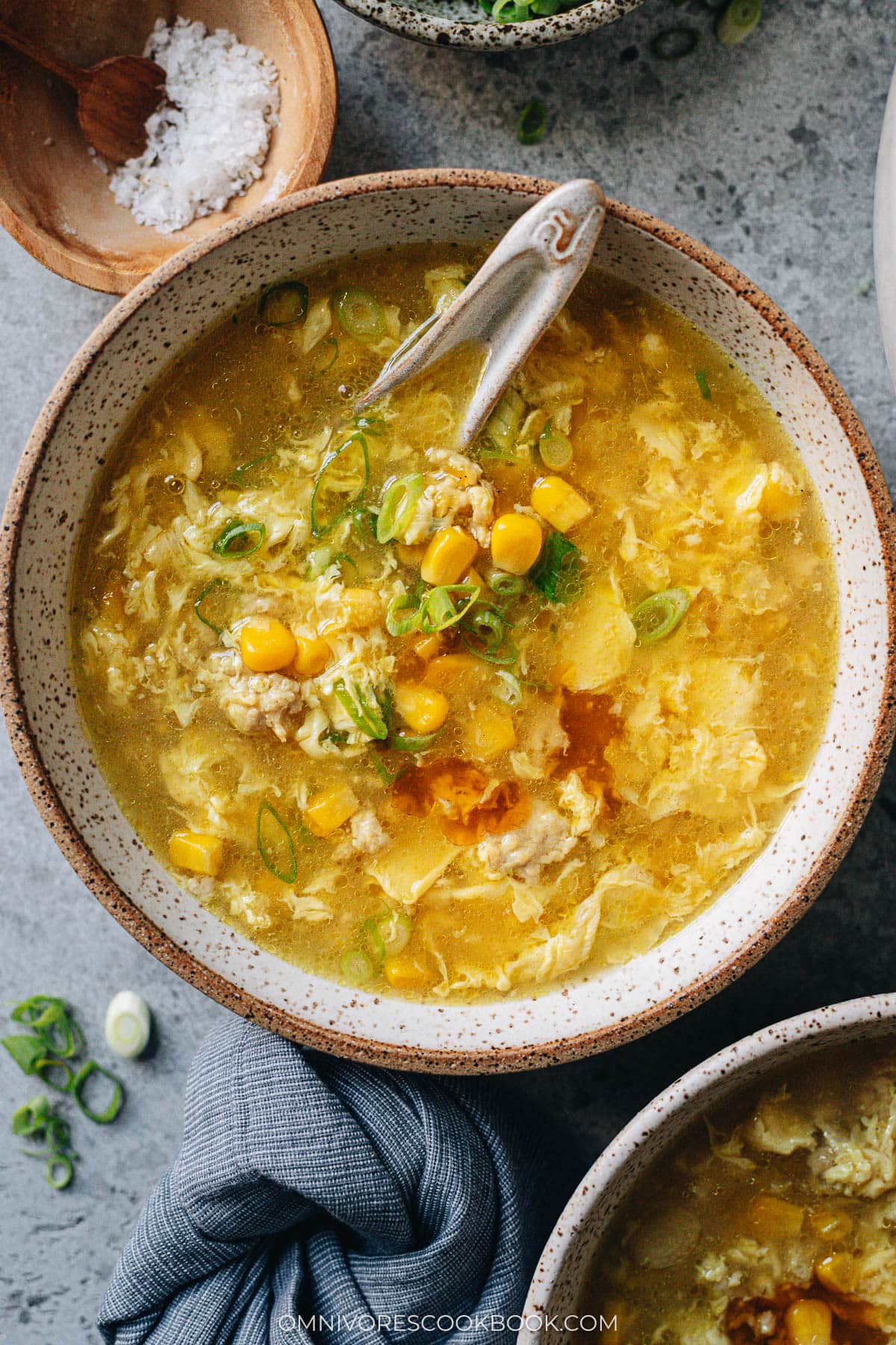 Chinese corn soup with chicken in a bowl