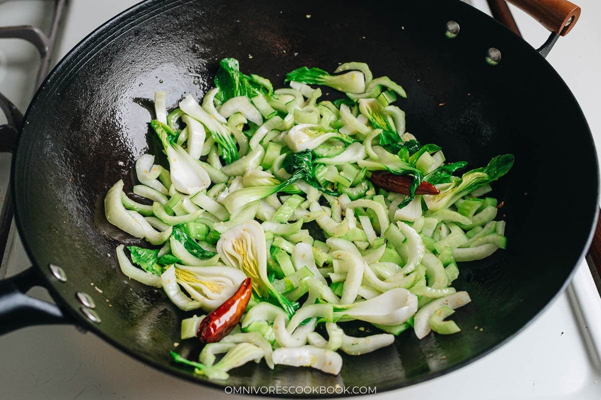 Bok choy stems cooked in a hot wok