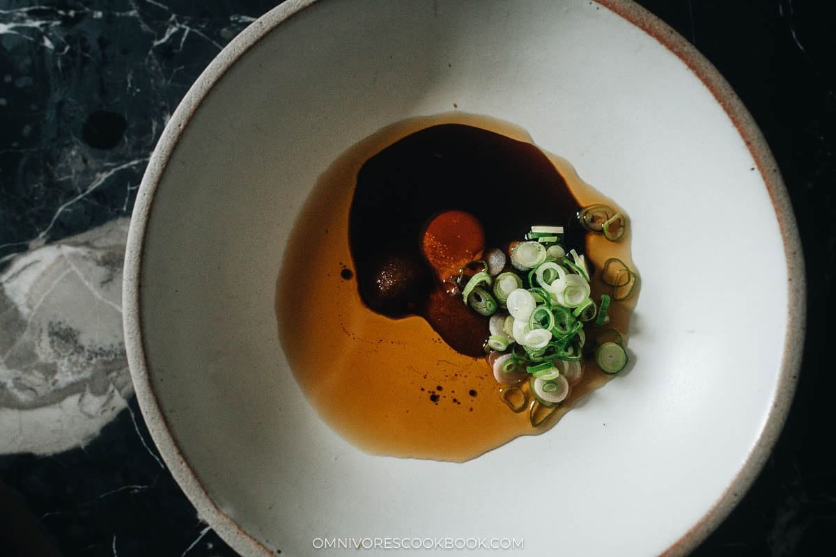 green onions, sugar, chicken bouillon, sesame oil, and soy sauce in a bowl
