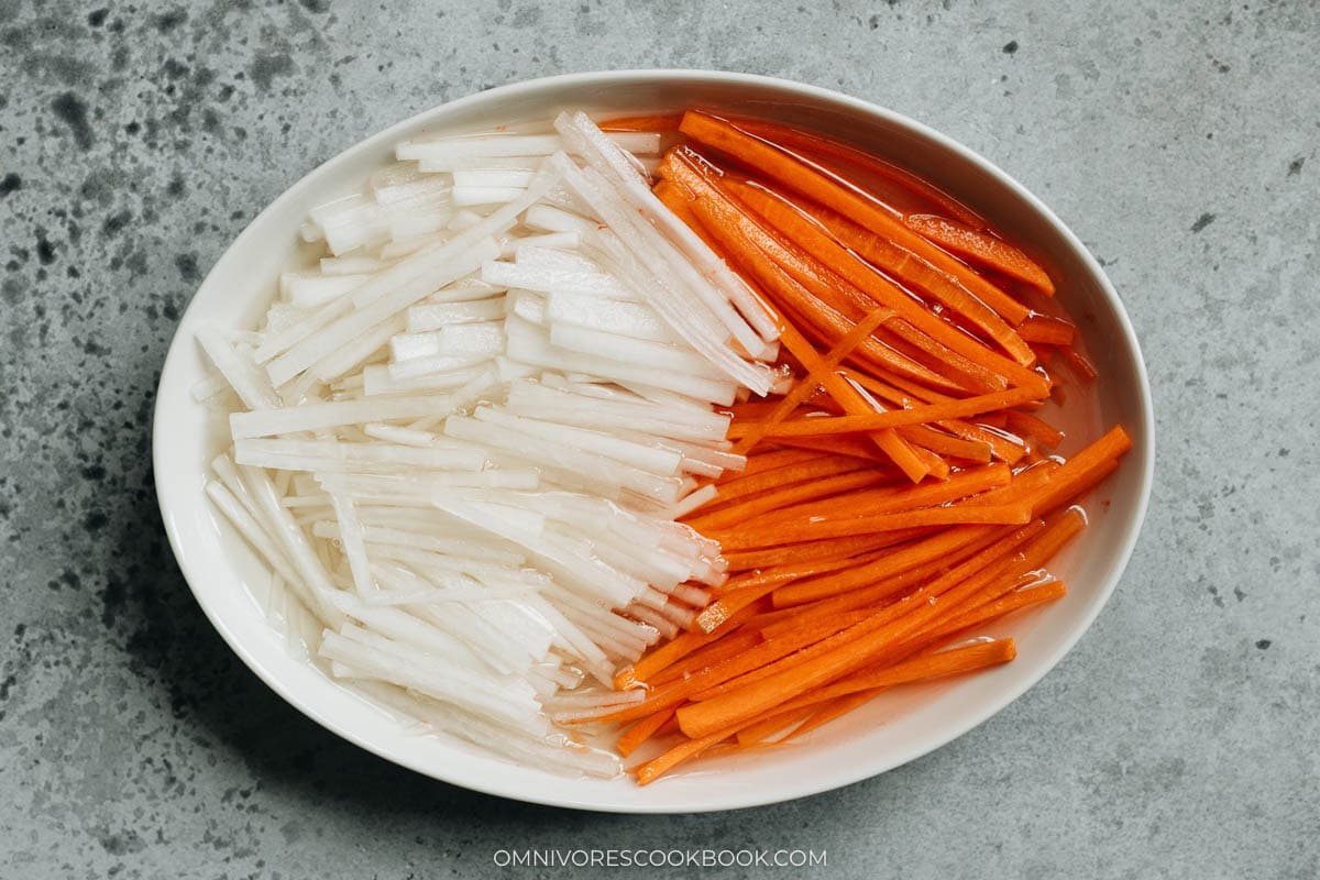 pickling the vegetables in a bowl