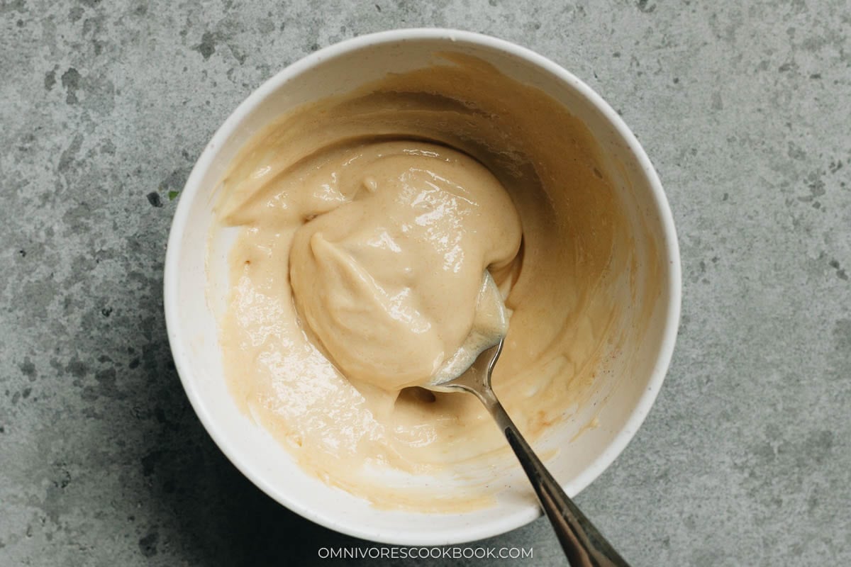 mixing the garlic mayo in a bowl