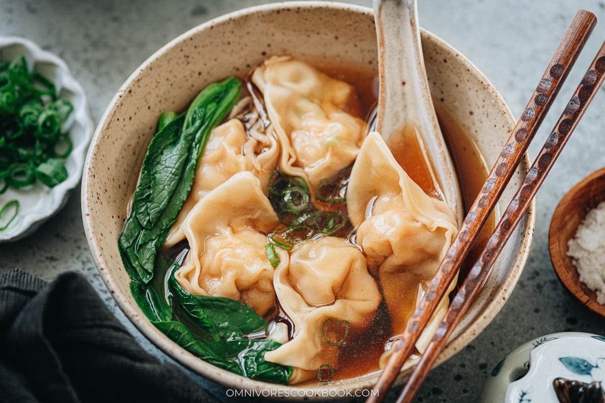 Homemade shrimp wonton soup with choy sum in broth