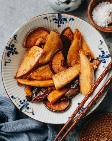 Braised bamboo shoots and shiitake mushrooms served in a bowl with chopsticks