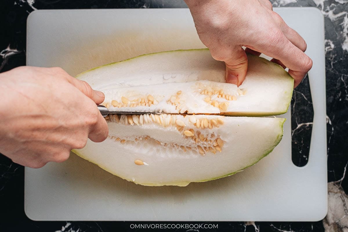 Cutting winter melon in half