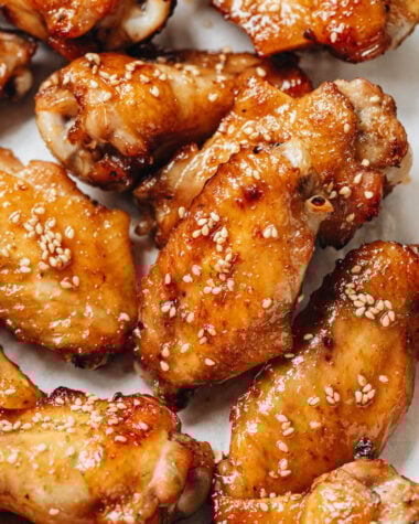 Baked Chimese honey soy chicken wings on parchment lined baking sheet