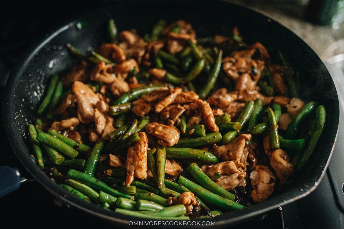 adding the chicken to the pan