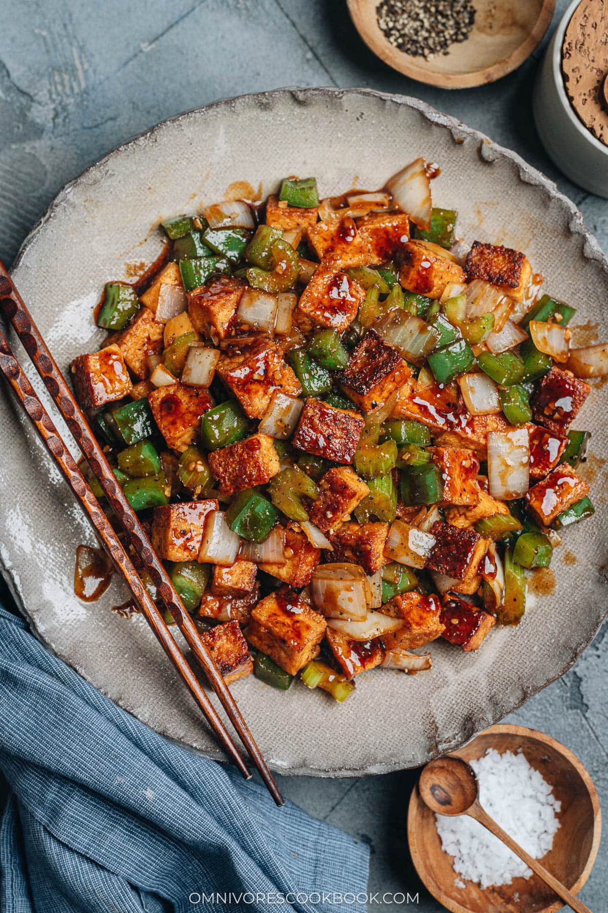 Close-up of crispy stir-fried tofu, green pepper, celery, and onion