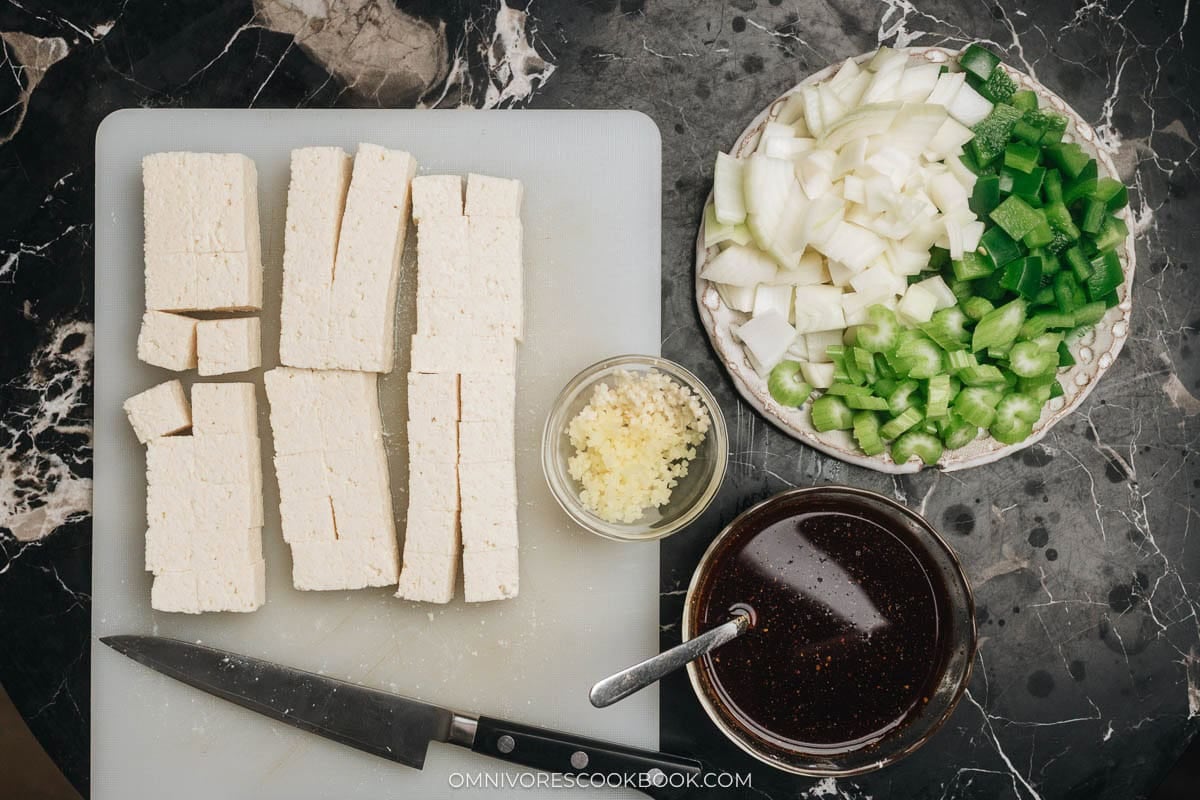 Chopped tofu and other ingredients on a table