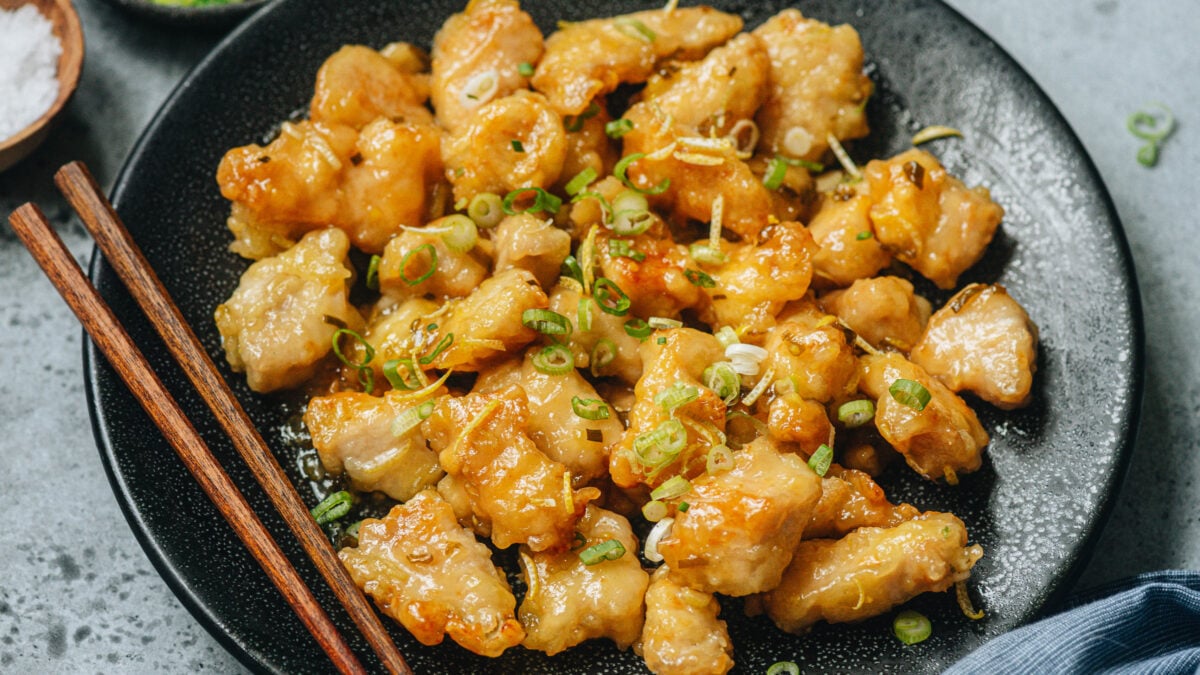 Chinese Lemon Chicken serve on a black plate