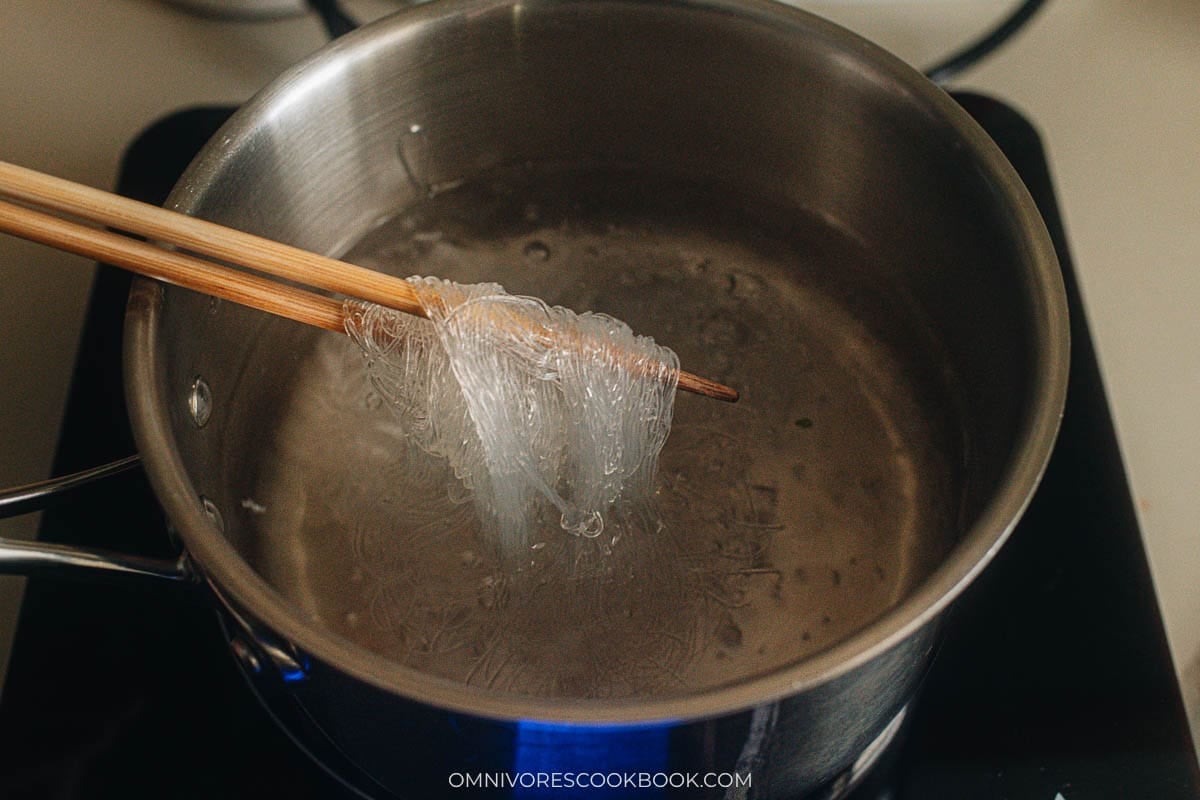 cooking the noodles in a pan