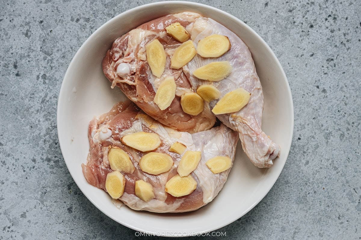 chicken on a plate and ginger slices