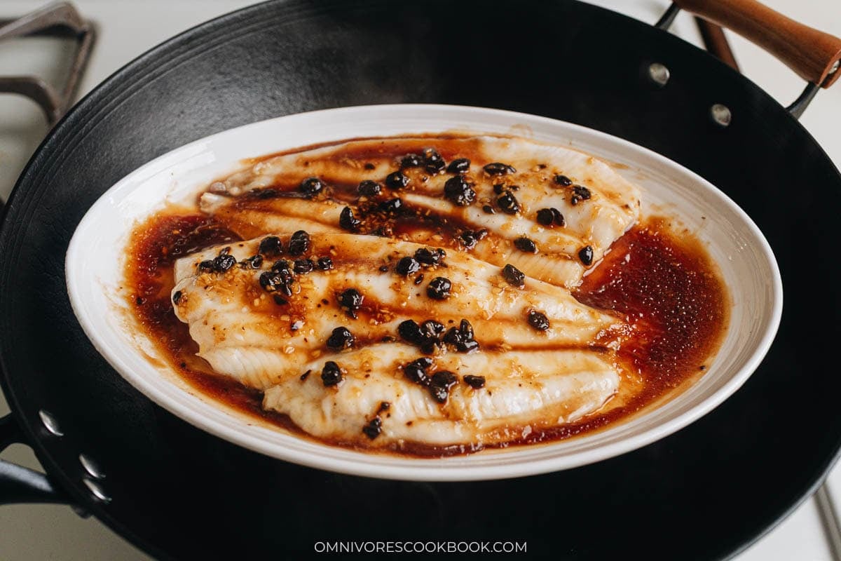 Steaming the fish in a pan