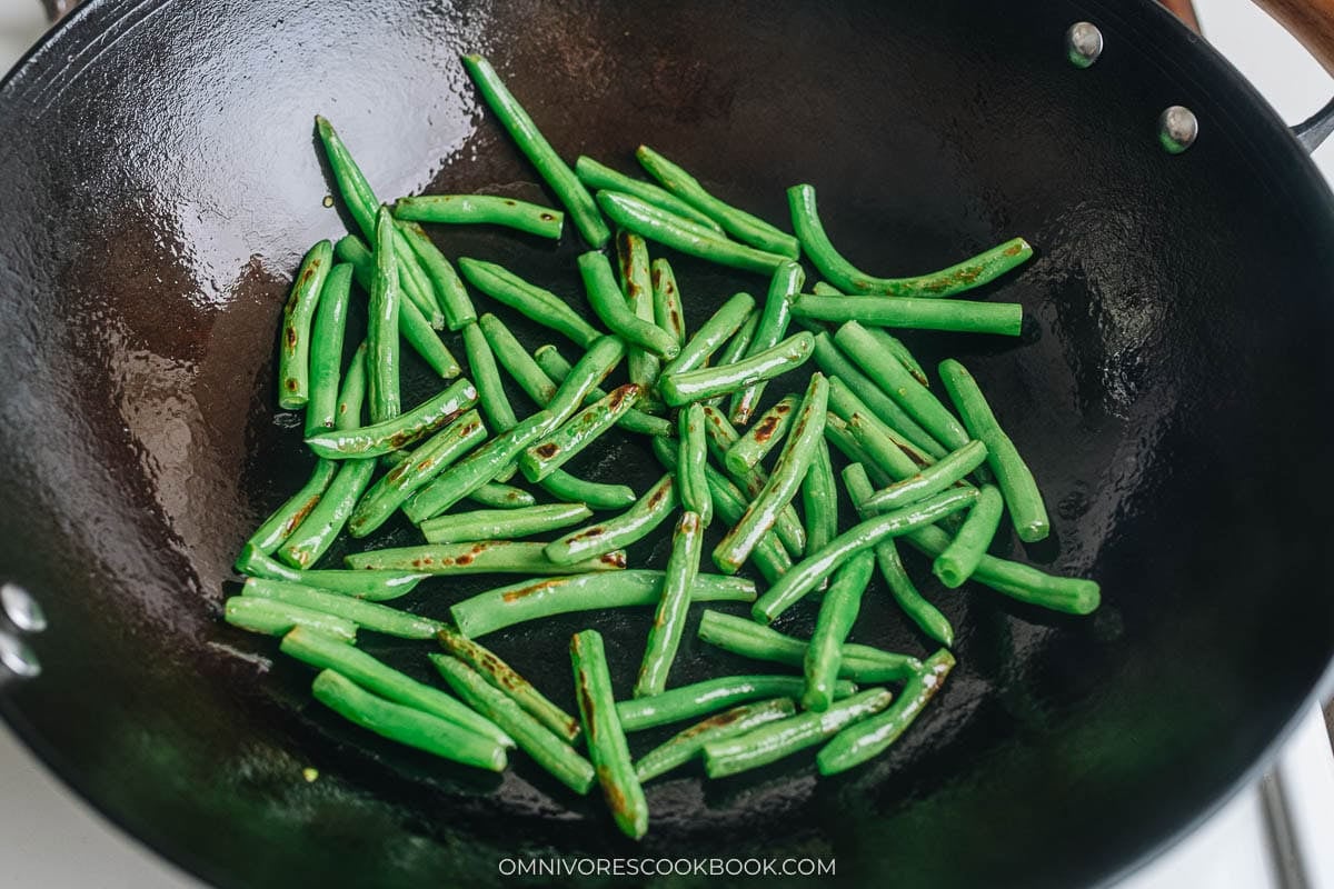 Cooking green beans cooking in wok