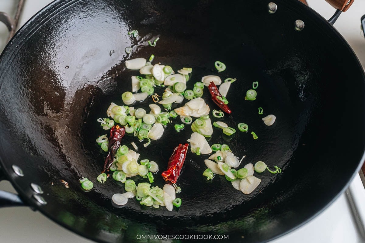 Cook garlic scallion and dried chili frying in a wok