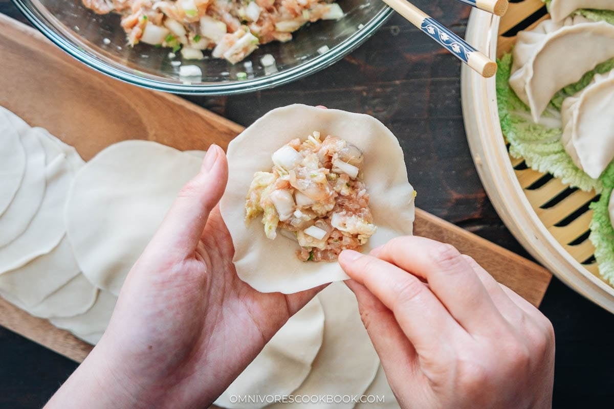 placing the filling inside the wrapper