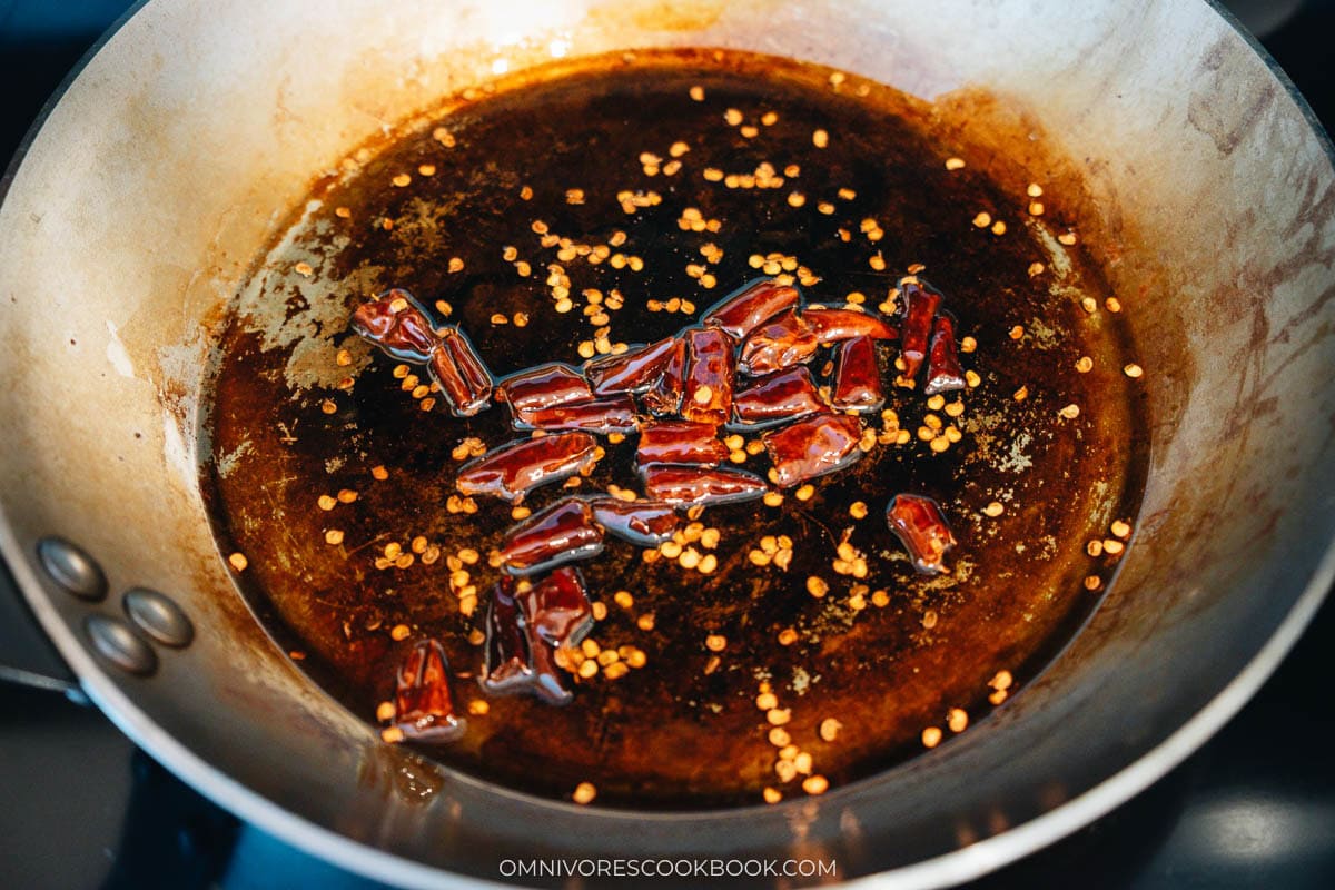 chilies cooking in oil