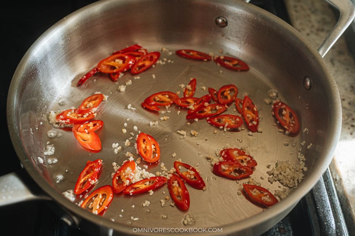 cooking the red chili with garlic