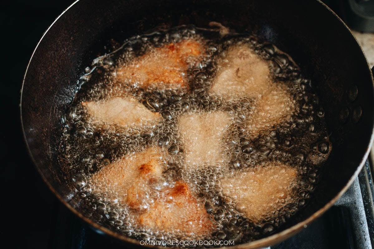 frying the pork in a oil pan