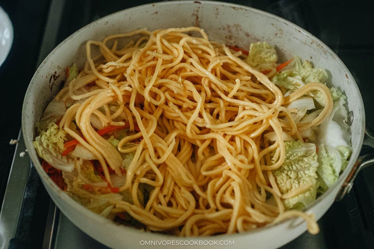 adding the noodles in a pan