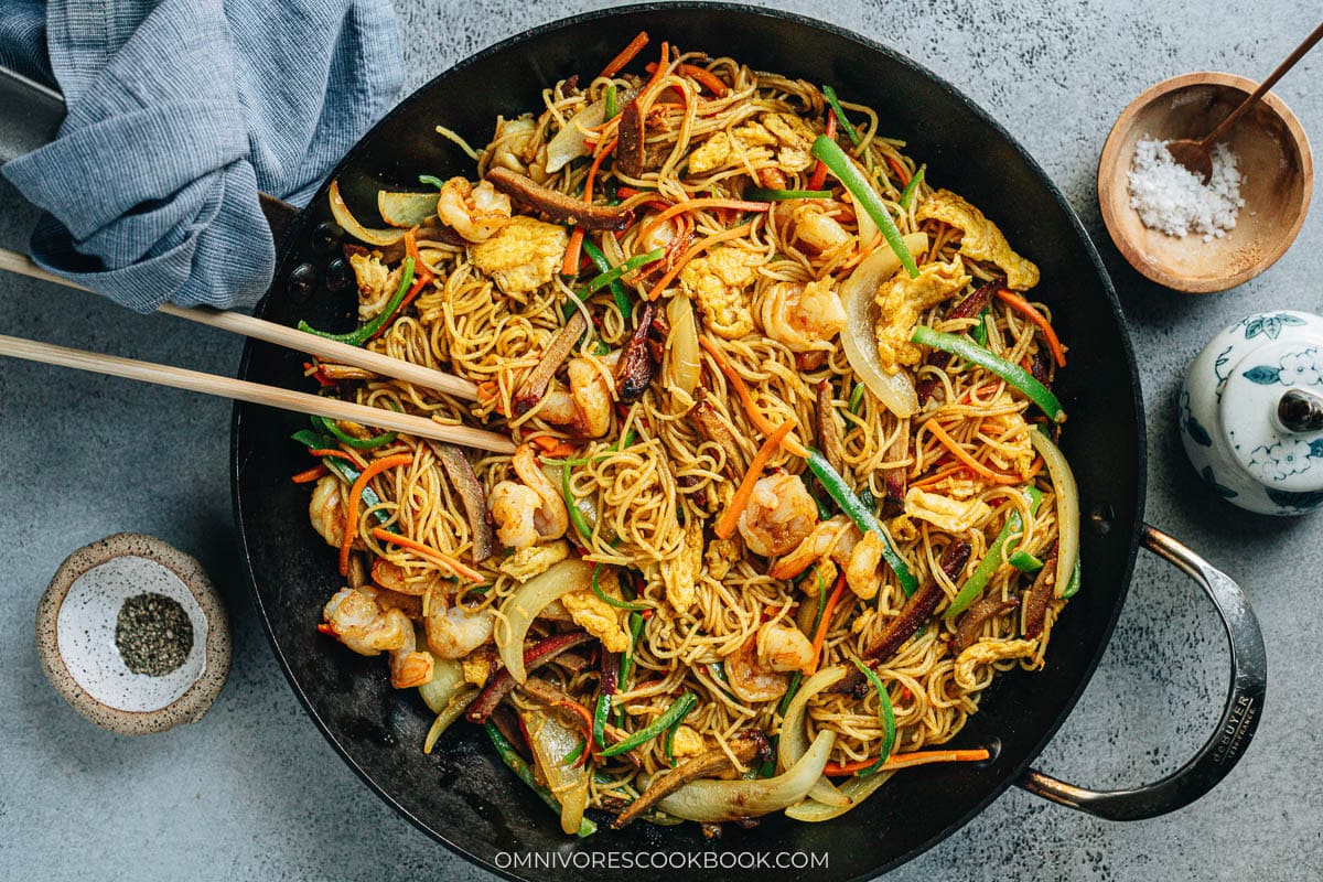 Singapore noodles loaded with shrimp, char siu pork, egg, onion, and pepper
