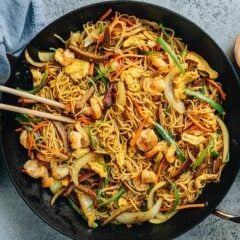 Singapore noodles loaded with shrimp, char siu pork, egg, onion, and pepper