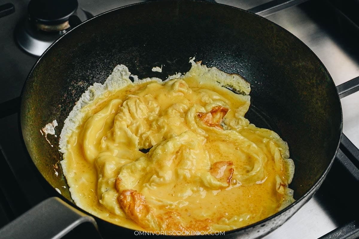Scramble eggs in a small wok