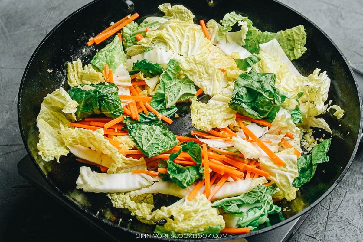 adding the veggies to the pan