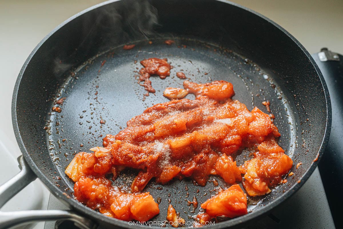 mixing in the pasta and sugar