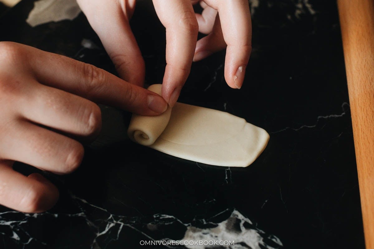 Rolling dough strip into a spiral
