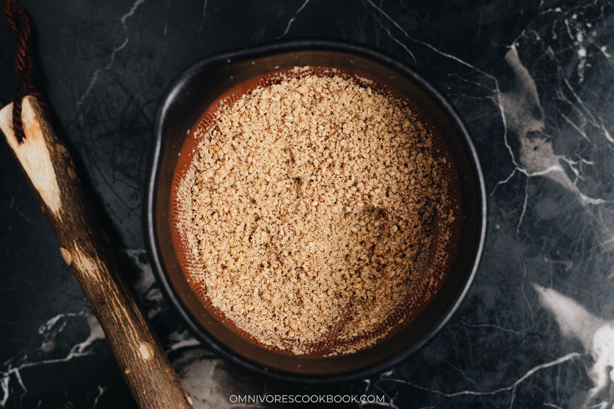 Grind ground sesame and coconut mixture