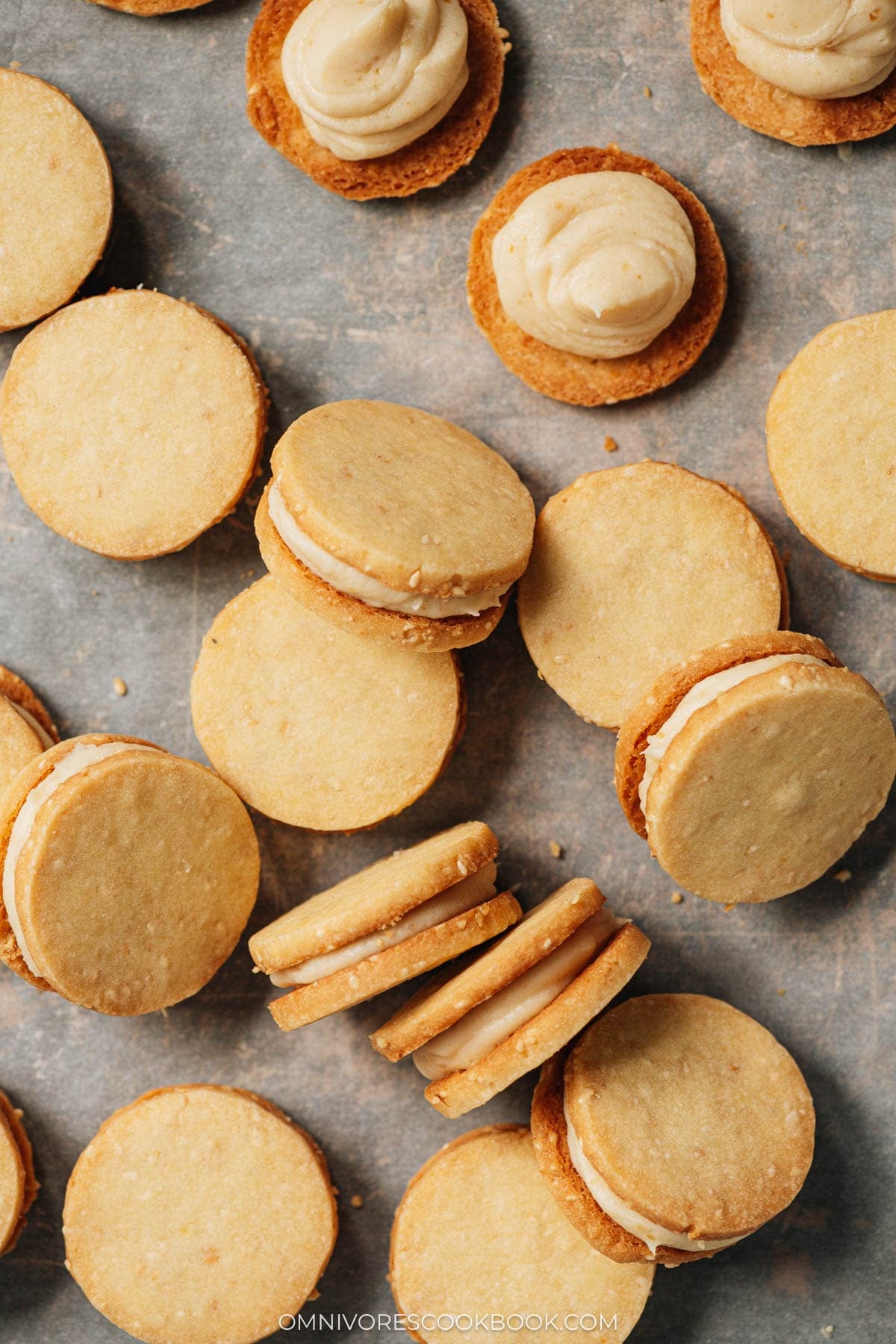 Sesame miso shortbread sandwich on a lined sheet pan vintage view