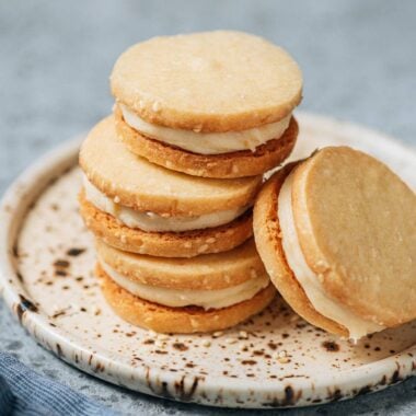 Sesame miso shortbread cookies stacked on plate