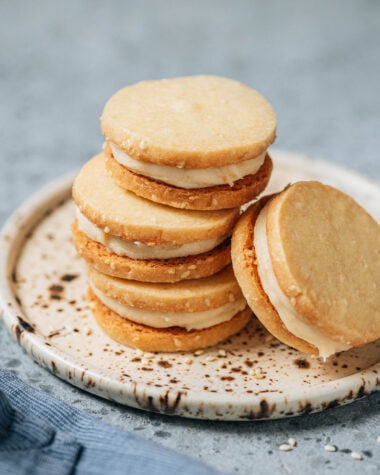 Sesame miso shortbread cookies stacked on plate