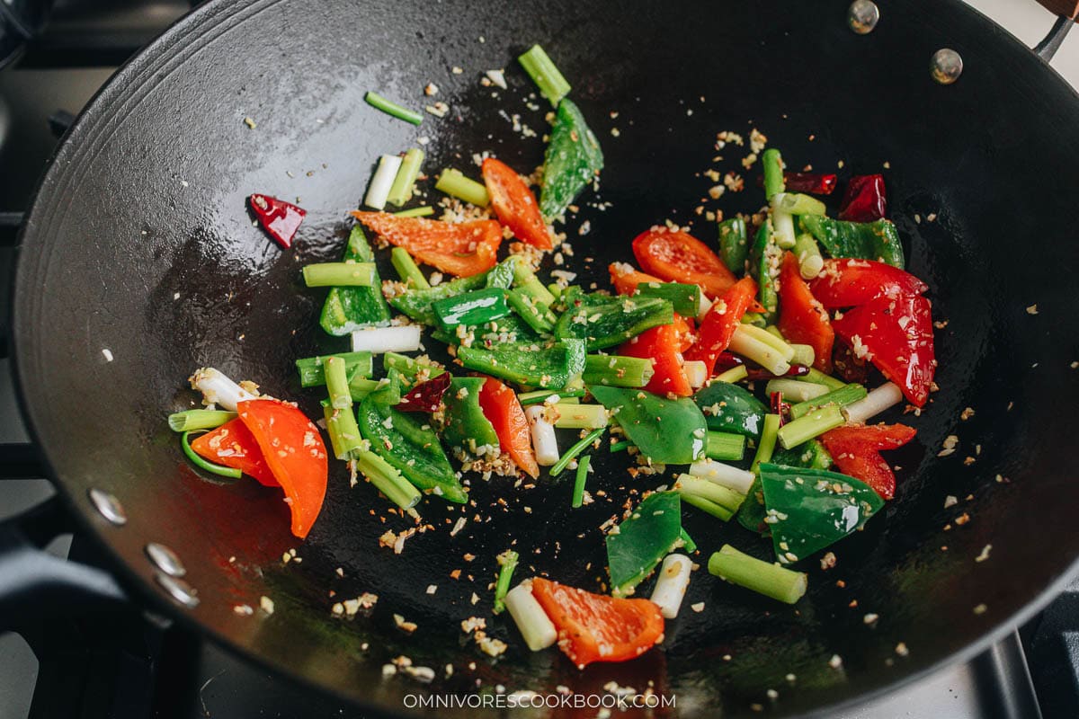 Cooking the pepper and onion
