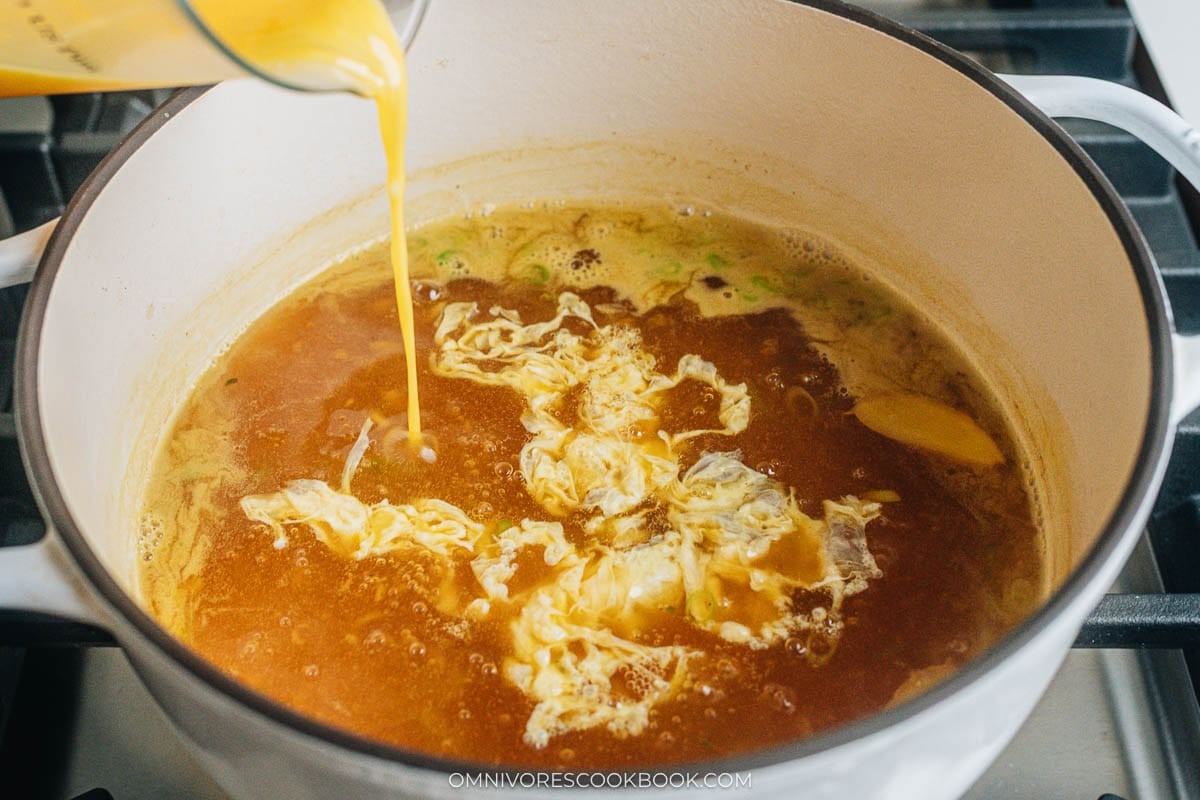drizzling the eggs in the pot