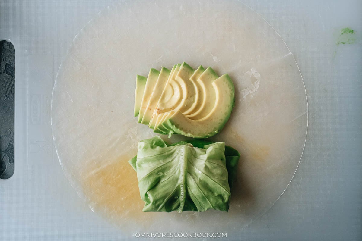 meat wrapped in lettuce with avocado